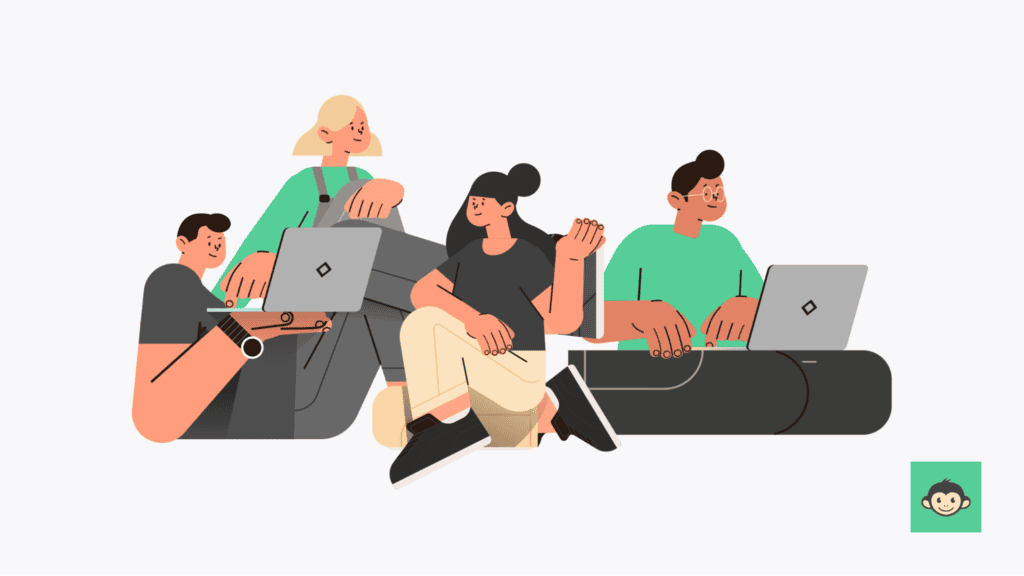 The image illustrates four individuals in a work environment, comfortably collaborating as they discuss and work on their laptops. Two appear to be women, while the other two are men, dressed alternately in black and green tops. All are seated on the ground.